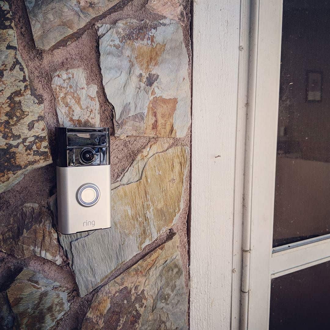 Video doorbell mounted beside a front door