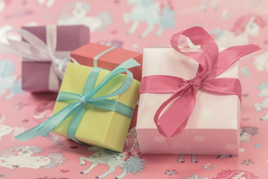 Pile colorful wrapped gift boxes