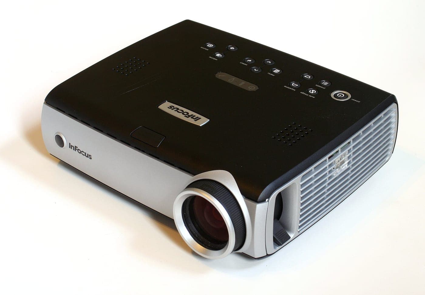 Video projector casting an image in a darkened room