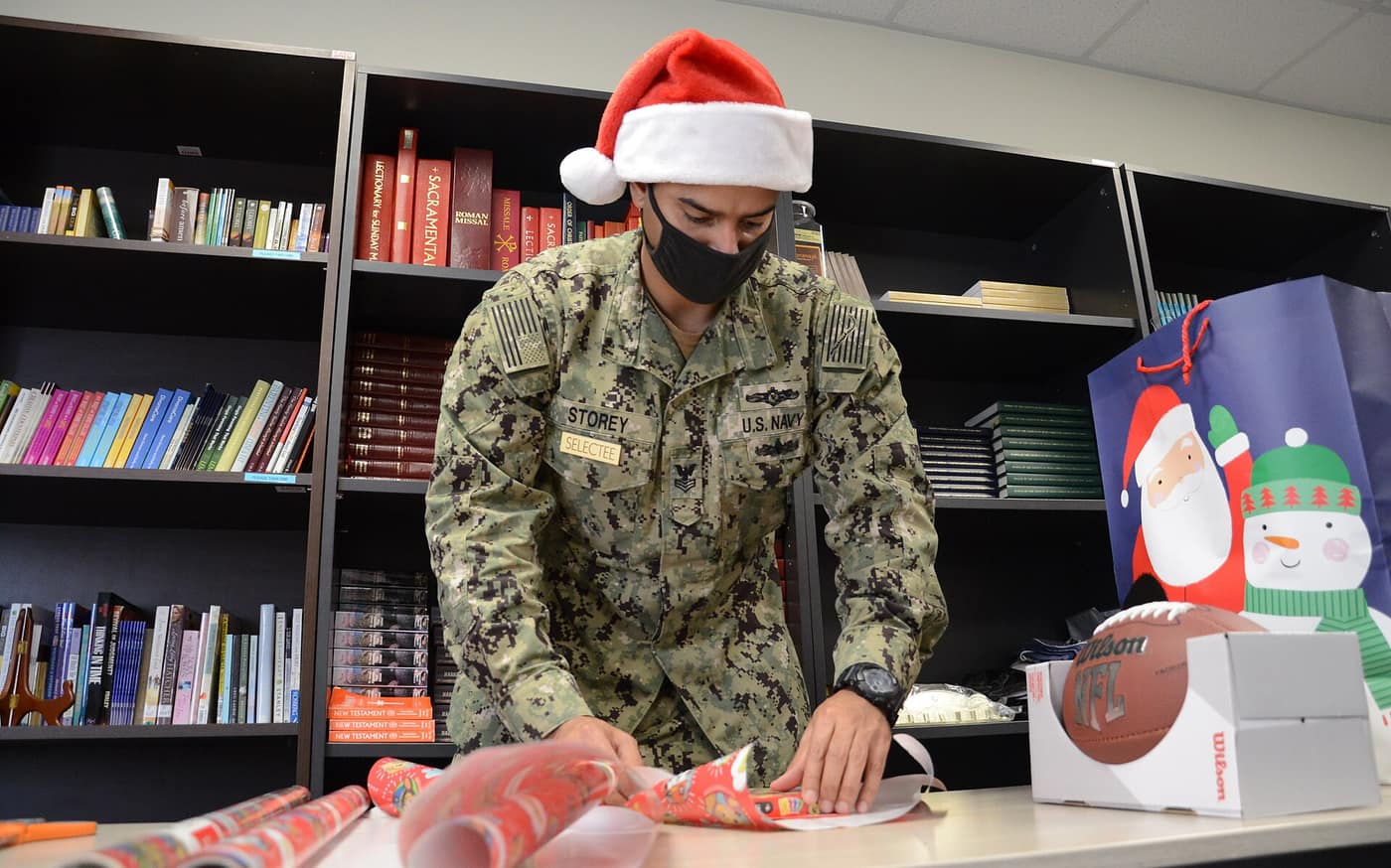 NSA Souda Bay Sailors Wrap Presents for a Holiday Gift Donation